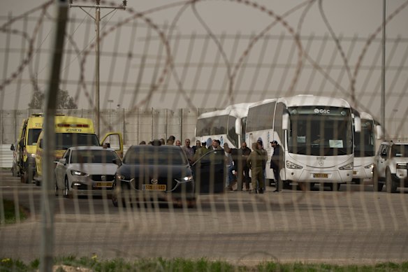Buses carrying Palestinian patients from Gaza Strip gather to leave the Kerem Shalom crossing in southern Israel.