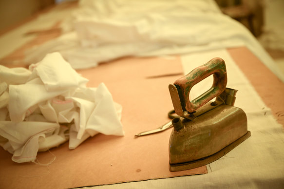 The cotton shrouds for the ritual of tahara are ironed at Melbourne Chevra Kadisha.