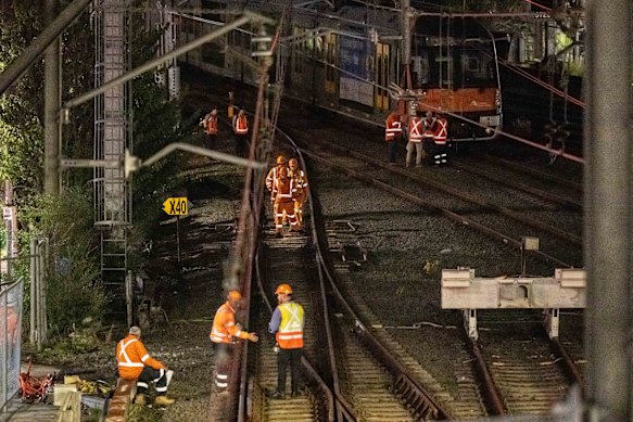 Workers near the site on Tuesday evening. 