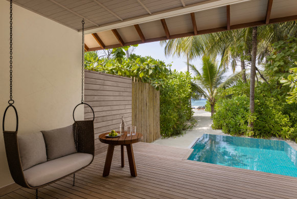 Beach villas, some with pools, are steps to the ocean, with loungers set up daily by the water. 