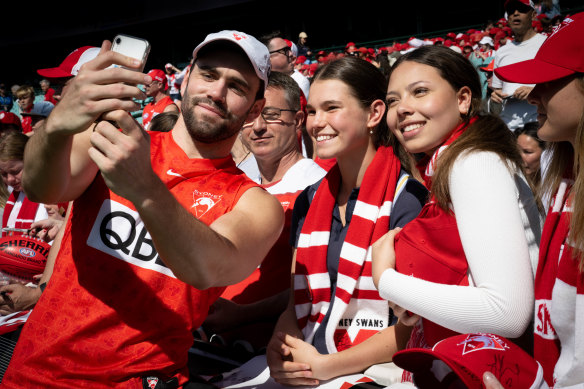 Paddy McCartin mixes with Swans fans during Tuesday’s open training session.