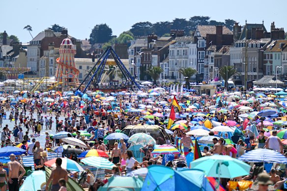 Crowds at the beach on Sunday in Weymouth on the southern English coast.