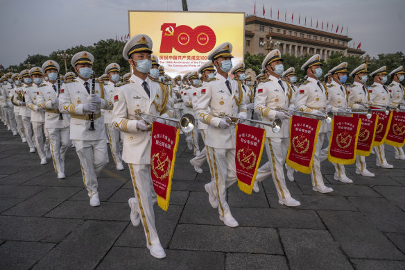 Members of a People’s Liberation Army ceremonial band march at a ceremony marking the 100th anniversary of the Communist Party on July 1 last year at Tiananmen Square in Beijing. 