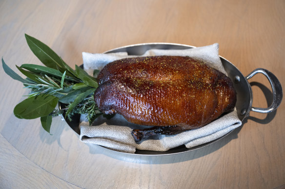 The presentation of the whole duck before it is served.
