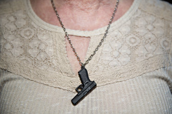 A woman wears a necklace at the National Rifle Association's annual meeting in Dallas, Texas, in May.