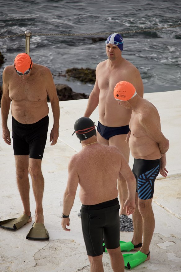 The manager and co-owner of Icebergs Gym, Ben Cush (in blue cap), hanging pre-swim with mates.