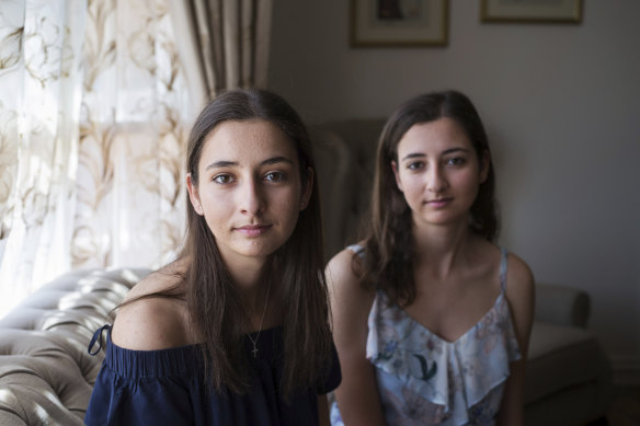 Identical twins Maya (L) and Sarah Ghassali.