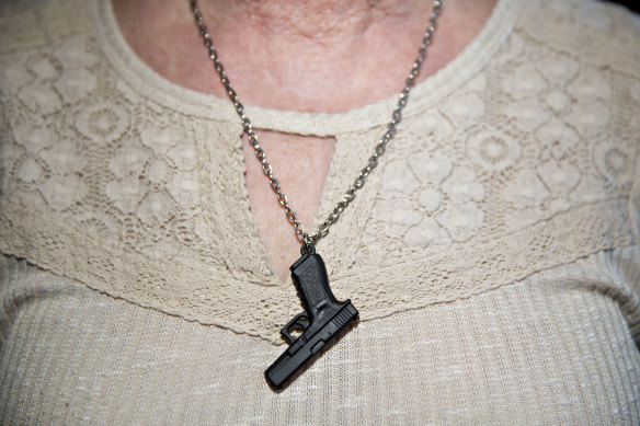 A woman wears a necklace at the National Rifle Association's annual meeting in Dallas, Texas, in May.