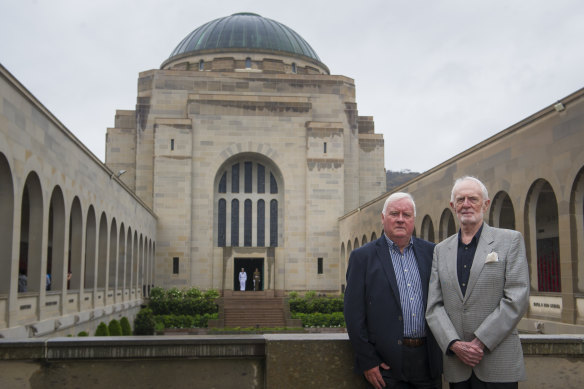 Former deputy director of the Australian War Memorial, Michael McKernan with former director of the Australian War Memorial, Brendon Kelson, 25 years since the Unknown Solider was interred in the Hall of Memory behind them. 