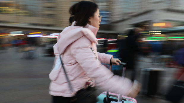 Rushing to the check-in counter.