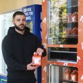 Cake Mail founder Jonathan Mussaad at his new Chatswood vending machine.