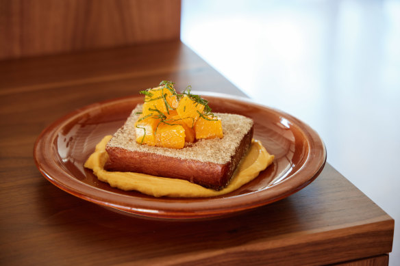 Fried milk bread dusted in cardamom sugar, orange, citrus curd and mint at Ophelia.