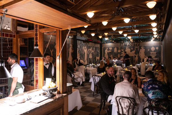 The main 50-seat dining room is lined with an Etruscan mural, giving it the air of a basement crypt.