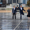 Mooney Valley council candidate Pierce Tyson, Lord Mayor candidate Nick Reece and Port Phillip council candidate Heather Consulo at the solar array on top of Wilson Hall at the University of Melbourne.