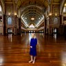 
Dr. Michelle Stevenson (Head of History & Technology, Museums Victoria) and the Charles Nuttall painting “The Opening, Commonwealth Parliament”
This weekend is the 125th anniversary of the opening of Australia’s Federal Parliament, which took place at the Royal Exhibition Building on May 9, 1901.
A key focus is the massive four-metre canvas by artist Charles Nuttall, which depicts the first sitting.