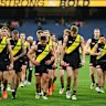 A dejected group of Tigers trudge off the MCG after Saturday’s disappointing performance against Sydney.