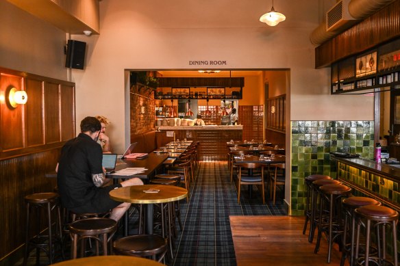 Newly installed tartan carpet leading into the pub dining room.