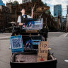 SMH:
Busker Keisei Nakamura busks under the name Gaku at George and Park St Sydney CBD to make money in an increasingly cashless world.
Wednesday 4 May, 2022, Photos by Oscar Colman
