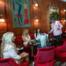 Red velvet seats and timber panelling has helped transform a onetime bike shop into a rococo bordello.