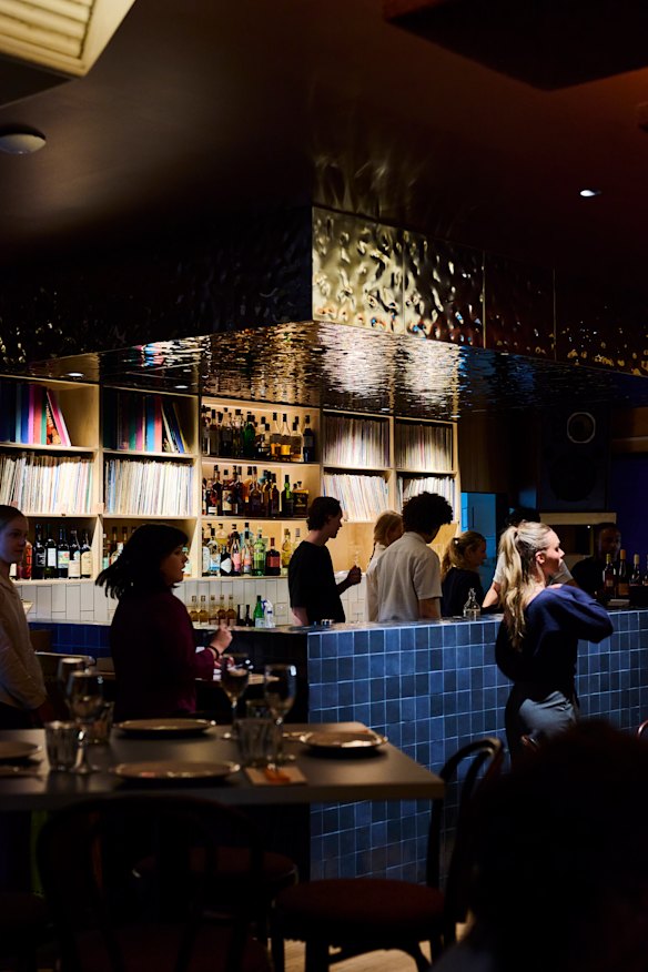 Hundreds of vinyl records line the back bar.