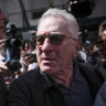 Robert De Niro, center, argues with a Trump supporter after speaking to reporters in support of Joe Biden