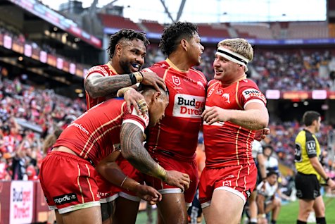 Dolphins celebrate a try.