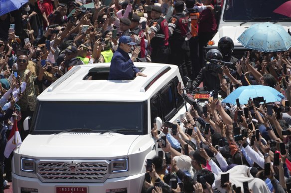 Prabowo Subianto waves to supporters after being sworn in as Indonesia’s eighth president in Jakarta.