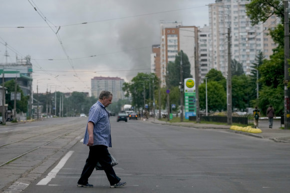 Smoke rises after Russian missile strikes in Kyiv on Sunday.