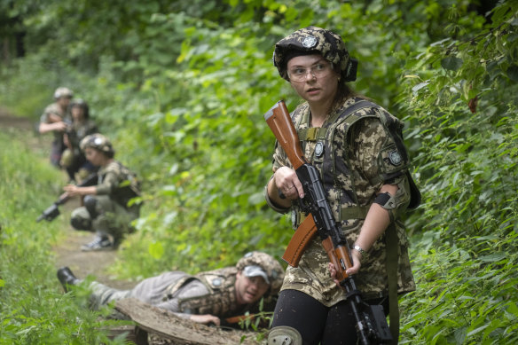Volunteers practise during military training for civilians close to Kyiv, Ukraine, on Friday.