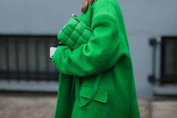 A Bottega Veneta bag and oversized coat spotted on the street at Paris Fashion Week in March.
