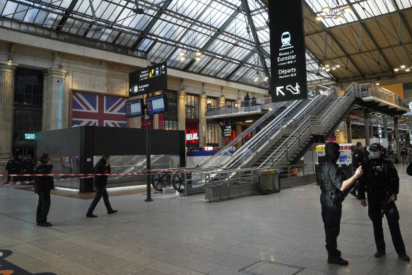 Police officers secure access to the Eurostar trains connecting France with Great Britain at the Gare du Nord train station.