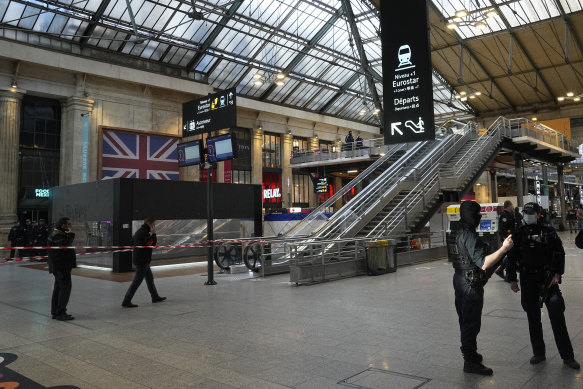 Police officers secure the access to Eurostar trains linking France to Britain, at the Gare du Nord train station.