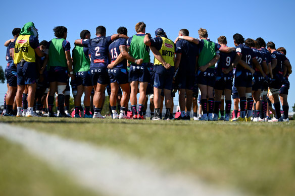Rebels players in a huddle at training.
