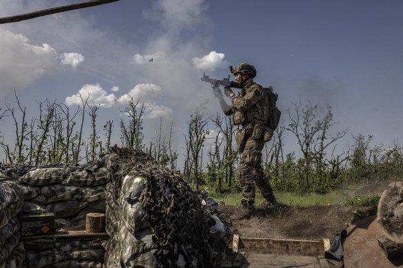 A Ukrainian soldier from the 79th Brigade firing toward Russian positions near the town of Marinka in eastern Ukraine.