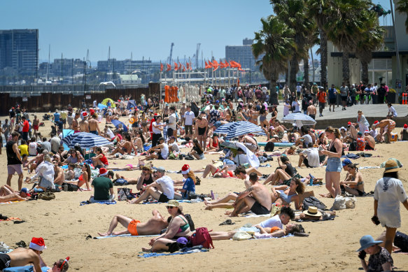 Beachgoers flocked to St Kilda on Christmas Day.