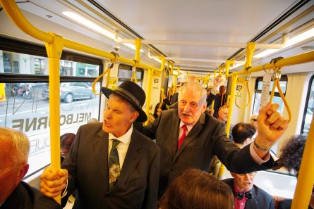 Destination England: Men in Suits practised for their upcoming overseas tour by singing on a Brunswick bound tram.
