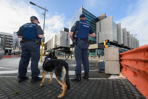 Police dog handlers are seen in front of Christchurch High Court prior to the sentencing hearing of Brenton Tarrant on Tuesday.