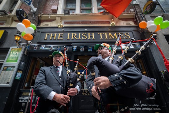 Rob Murphy (left) and Chris Bouwmeester from the City of Melbourne Highland Pipe Band played at the Irish Times pub.