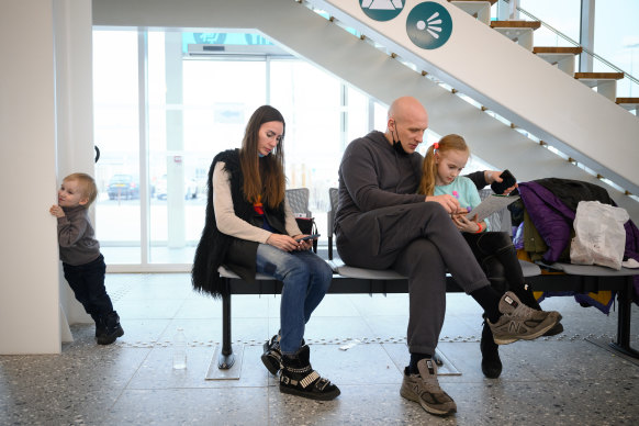 After fleeing Kharkiv, Oksana and Sergei Koletvinov wait to speak to UK Home Office officials in a ferry port building in Calais on Friday. 