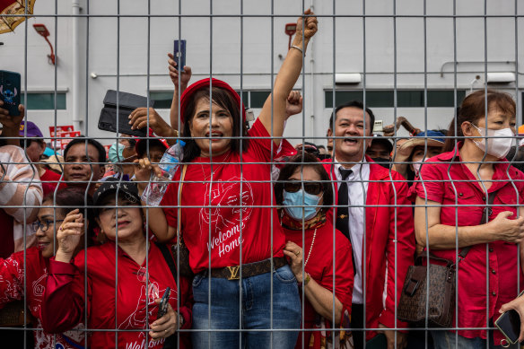 Supporters of the former Thai prime minister gather for his arrival outside Don Mueang International Airport.