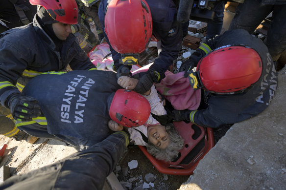 Rescue teams evacuate a survivor from the rubble of a destroyed building in Kahramanmaras, southern Turkey.