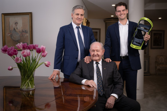 Merv Cross (seated), his son Tom Cross and grandson, patient and doctor Matt Dowsett, with the new brace that aids recovery from ACL injuries.