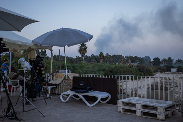 Smoke rises over the beach after an Israeli airstrike in Tyre, Lebanon. 