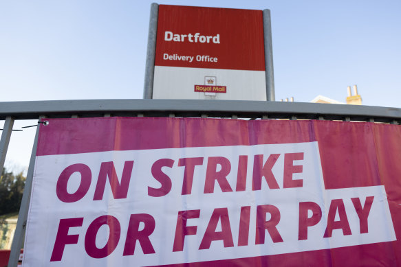 A sign hangs on a picket line at Dartford delivery office in Dartford, England. 
