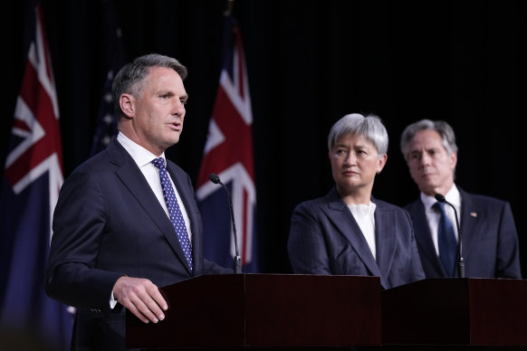 Deputy Prime Minister Richard Marles stands with Foreign Minister Penny Wong and US Secretary of State Antony Blinken at a news conference at the United States Naval Academy on Tuesday.