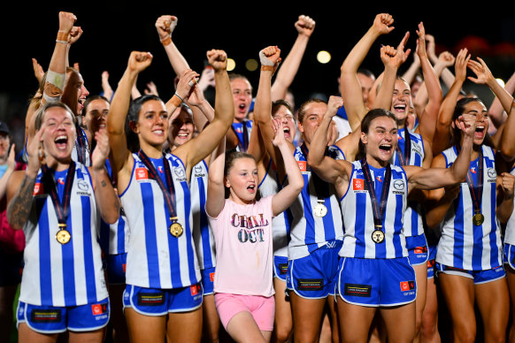 The Kangaroos celebrate their premiership.