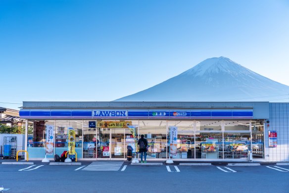 A Lawson convenience store with Mount Fuji in the background.