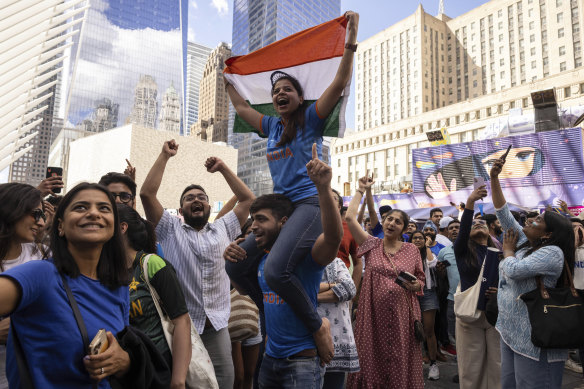 India fans celebrate at a viewing party in New York during the World Cup clash with Pakistan.