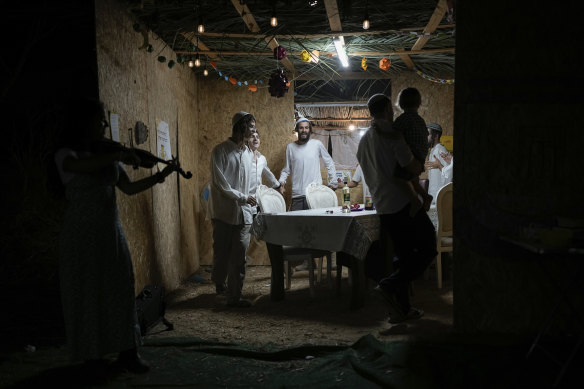 Israelis celebrate the death of Sinwar, near Kibbutz Erez in southern Israel.