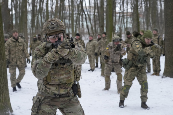 Members of Ukraine’s Territorial Defence Forces, volunteer military units of the Armed Forces, train in a city park in Kyiv, Ukraine.